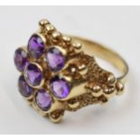 9ct gold ring set with 7 amethysts, 5.1 grams, size N/O.