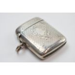 Hallmarked silver vesta case with engineered decoration, Birmingham 1900, 22.5 grams. Dent to rear