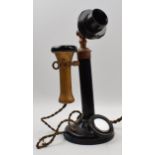 Early 20th century telephone on original flex with mirror panel. Height 32cm. In good original