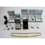 A mixed collection of jewellery to include silver and gold on silver rings, earrings and pendants