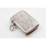 Hallmarked silver vesta case with floral decoration, 14.7 grams.