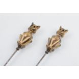 A pair of vintage brass and steel cat hat pins (2), 22cm long.