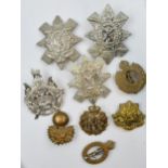 A collection of military badges to include Royal Corps, The Royal Highlanders and others (Qty).