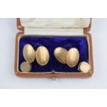 A cased pair of 9ct gold cufflinks with engineered decorated, 6.6 grams, with a yellow metal pair of