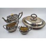 Silver plate to include a three piece tea set with a plated entree dish (4).