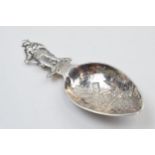 Dutch silver novelty caddy spoon with figural finial, 9.5cm long, 14.8 grams. Repair to handle.