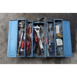 Vintage blue metal folding toolbox with contents of various tools and equipment.