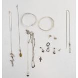 A quantity of silver jewellery to include pendants and chains, bracelets, amber item and cross.