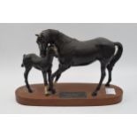 Beswick Black Beauty and Foal on wooden base. In good condition with no obvious damage or