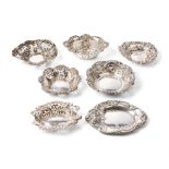 A collection of hallmarked silver sweet dishes of varying styles and sizes, combined weight 185.7