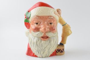Large Royal Doulton character jug Santa Claus with toy doll handle D6668. In good condition with