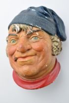Mid 20th century chalkware wall plaque in the form of a man wearing a hat, made in England, possibly