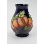 Moorcroft trial vase decorated with fruit and leaves, 7/4, 10cm tall. In good condition with no