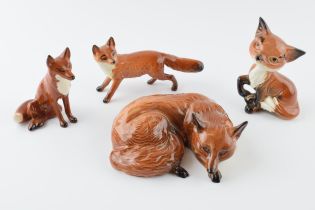 Beswick foxes to include comical fox 173, lying fox 1017 and 2 others (4). In good condition with no