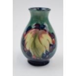 Moorcroft Leaf and Berries vase, 7/4, signed by William Moorcroft, 10cm tall. In good condition with