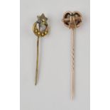 9ct gold stick pin (2.1g) together with another brass example. In good overall condition.