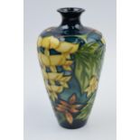 Boxed Moorcroft floral vase in the 'Wisteria' pattern, 72/6, silver line, 15.5cm tall. In good