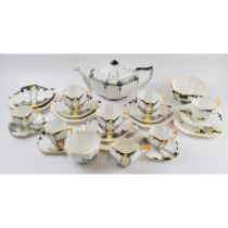 A collection of Shelley tea ware to include 11479 Sunset and Trees teapot (cracked), a quantity of
