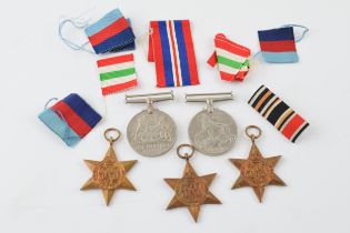 A collection of WWII medals to include The 1939 - 1945 Star, Africa Star, Italy Star, Defence