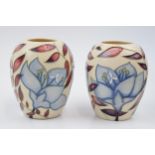 Boxed Moorcroft vases in the Jacob's Ladder pattern, 102/3, 9.5cm tall (2). In good condition with