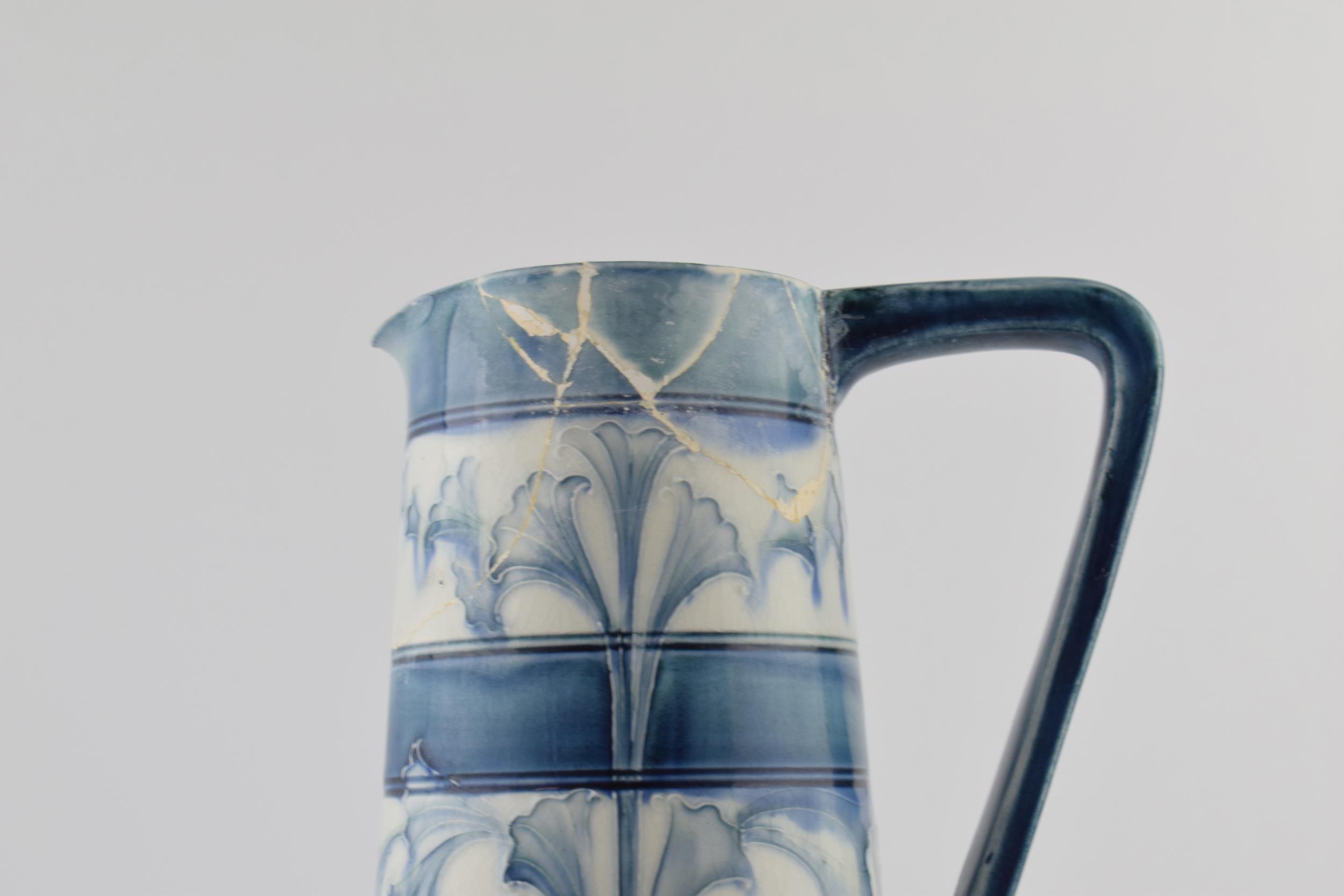 Early Moorcroft blue and white Florian pitcher, 28cm tall (restoration project). - Image 2 of 7