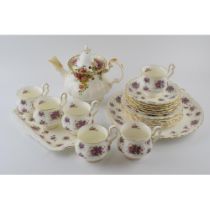 Royal Albert tea ware to include an Old Country Roses teapot with a set of 6 trios in the Violetta