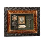 Framed Memento Mori containing lock of hair, carved wooden skull, crucifix, and plaque that reads "
