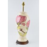 Large Moorcroft lamp base with pink floral pattern on a magnolia background, 35cm tall exc. brass