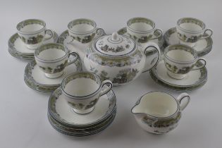 Wedgwood tea ware in the Chinese Legend design to include a teapot, a milk jug, 7 trios with a spare