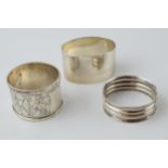 A trio of singular silver napkin rings, Birm 1887, 1924 and Sheffield 1971, 58.7 grams.