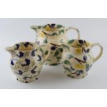 A trio of large Emma Bridgewater jugs to include 2 graduated olive / plum design with a dolphin