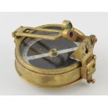 A military style sighting compass in brass case with screw thread for attaching to stand or mount.