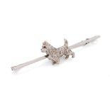 14ct white gold bar brooch with a terrier dog set with a ruby and diamonds, 3.9 grams, 5cm wide.