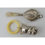 A pair of baby rattles to include a Chester 1923 example with Mother of Pearl handle and a white