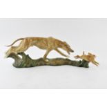 Elite Pottery hunting scene tableau in the form of lurcher chasing hare, length 48cm.