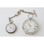 A silver Waltham pocket watch with gold coloured hands with a ladies sterling silver pocket watch
