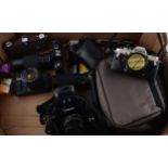 A collection of vintage 35mm SLR cameras and lenses to include, Canon A-1 camera with Canon lens