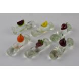 A set of 6 vintage glass knife rests with fruit finials, possibly French, 7.5cm long (6). In good