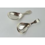 A pair of silver caddy spoons to include a Georgian London 1835 T Edwards example with a William