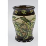 Boxed Moorcroft trial vase decorated with leaf and berries design with brown shaded background, by