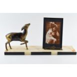 French Art Deco spelter figure of a deer with a photo frame depicting semi erotic scenes, mounted on