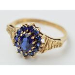 9ct gold ladies ring set with sapphires with textured shoulder, 2.6 grams, size R, in box.
