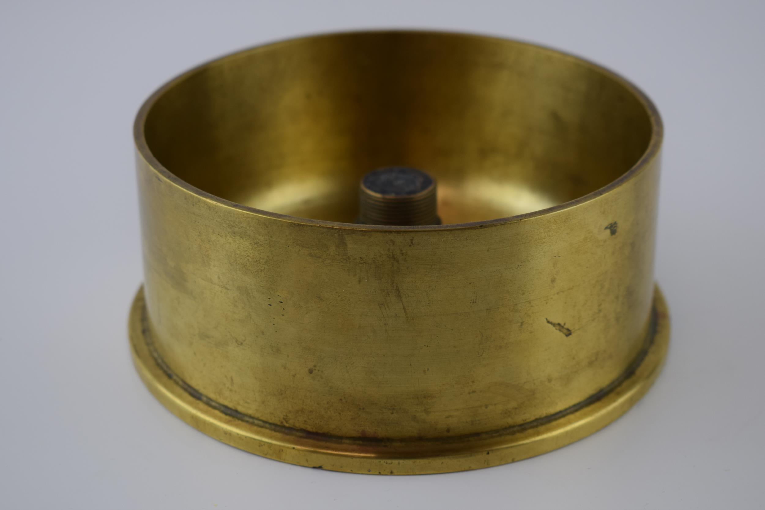 Large 1958 brass shell base / trench art, 16.5cm diameter.