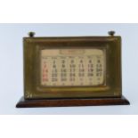 1930s brass fronted perpetual calendar complete with month and date cards with working scroll.