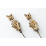 A pair of vintage brass and steel cat hat pins (2), 22cm long.