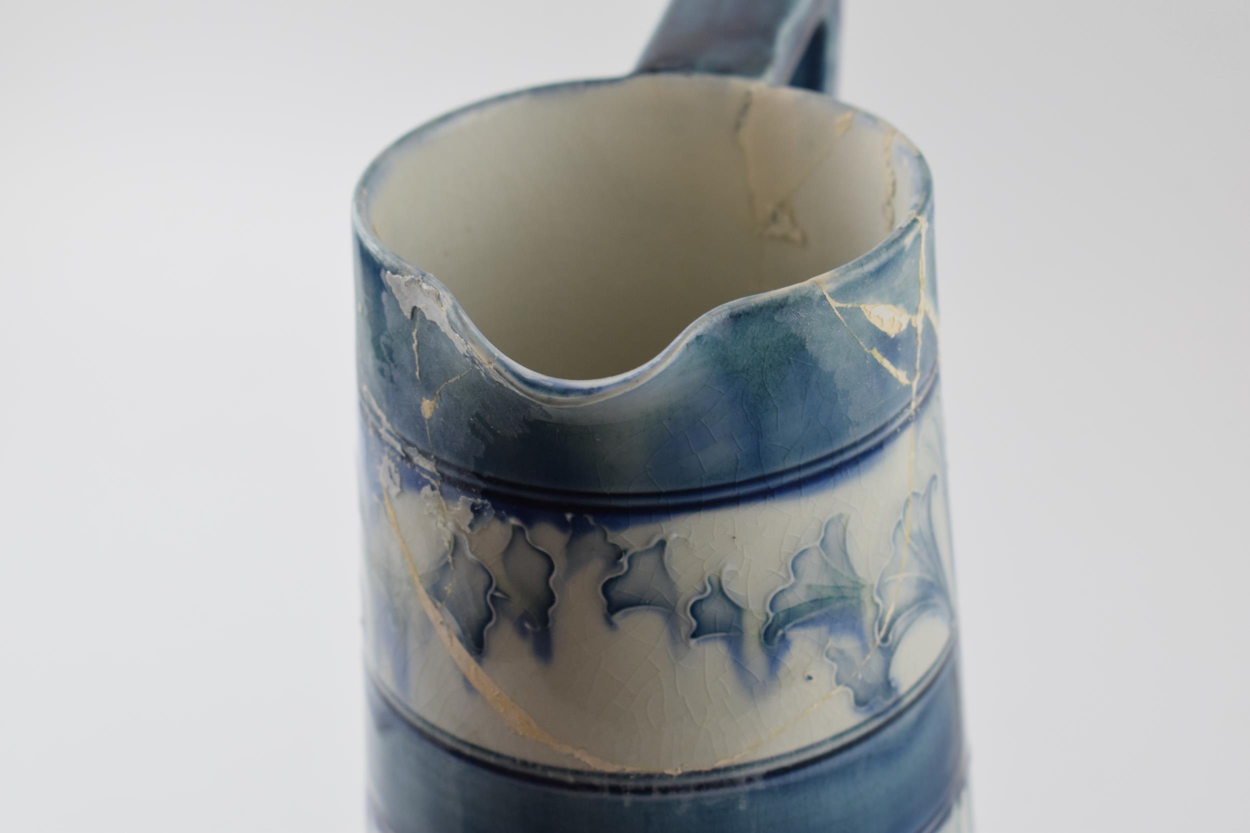 Early Moorcroft blue and white Florian pitcher, 28cm tall (restoration project). - Image 6 of 7