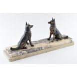 French Art Deco spelter figures consisting of a pair of alsatians, mounted on a marble base, 46cm