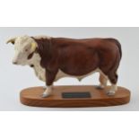 Beswick Connoisseur model of a Hereford Bull on wooden base. In good condition with no obvious