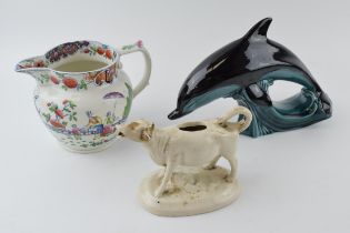 19th century Pearlware style jug (damaged) with traditional scenes with a Poole pottery dolphin