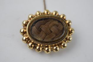 Victorian yellow coloured metal mourning brooch, bauble detail to run, hair to central glazed panel,